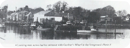 Black & White photo Looking west across harbor entrance with Gardner's Wharf in the foreground
